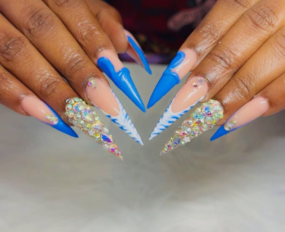 Blue stiletto nails with rhinestones and zebra accent
