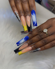 Blue swirl coffin nails with yellow and rhinestone detail