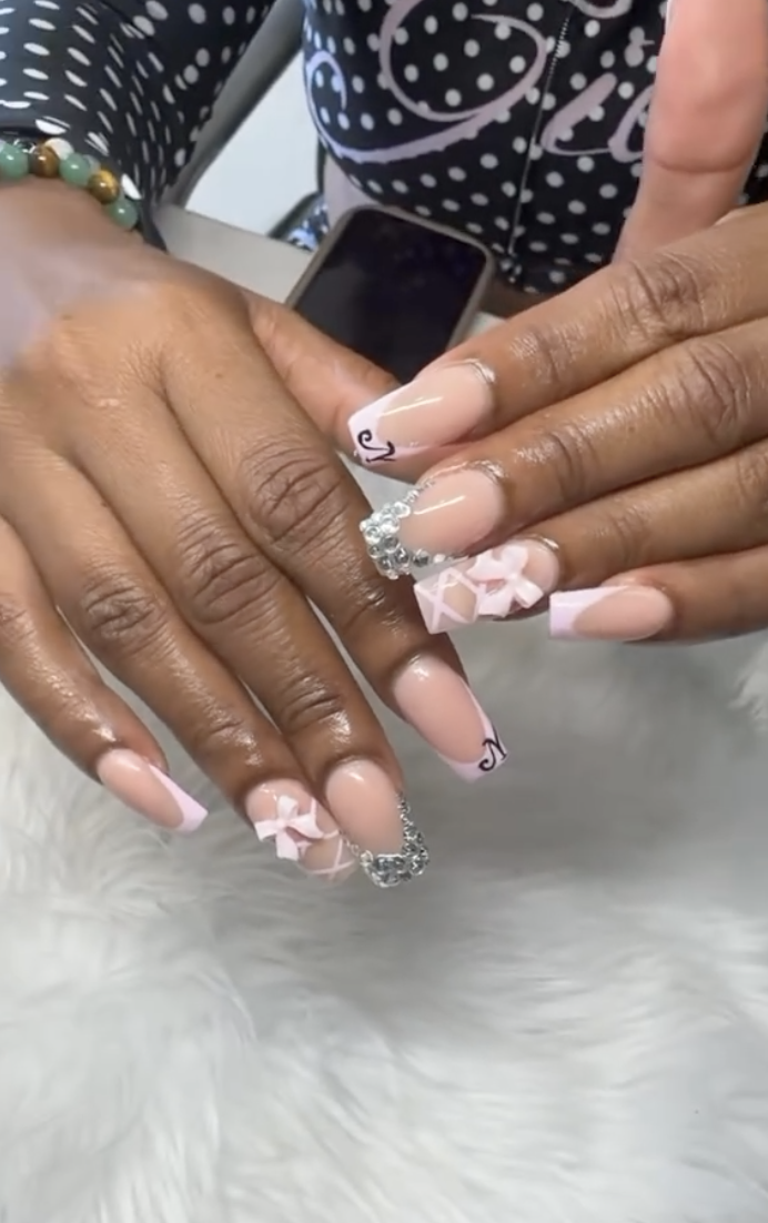 Nude coffin nails with pink French tips, 3D bows and rhinestones